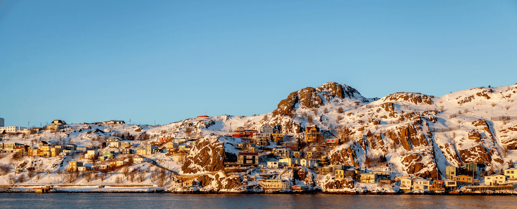 A photograph looking at the St. John's Battery in winter during a sunset.